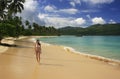 Young woman in bikini walking at Rincon beach, Samana peninsula Royalty Free Stock Photo