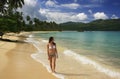 Young woman in bikini walking at Rincon beach, Samana peninsula Royalty Free Stock Photo