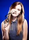 Young woman biting a nerd glasses with interested look