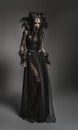 Young woman in black fantasy costume Royalty Free Stock Photo