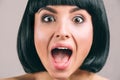 Young woman with black hair posing on camera. Emotional young brunette screaming. Bob haircut. Short black hair. Young Royalty Free Stock Photo