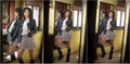 Young woman in black leather jacket and gray short tutu skirt looking into a large mirror. Beautiful curly dark hair girl posing Royalty Free Stock Photo