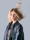 Young woman in a black leather rocker jacket. Royalty Free Stock Photo