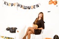 Young woman with black pumking Royalty Free Stock Photo
