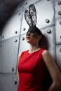Young woman in black rabbit or hare fancy mask and red dress Royalty Free Stock Photo