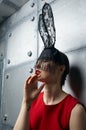 Young woman in black rabbit or hare fancy mask and red dress Royalty Free Stock Photo