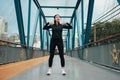 young woman exercise lightly on the bridge in the morning