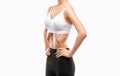 Young woman in black and white sportswear working out her abdominal muscles. Beautiful sporty woman is exercising and doing Royalty Free Stock Photo