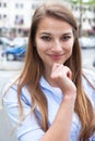 Young woman with blond hair in the city Royalty Free Stock Photo