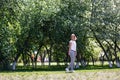 Young woman in blooming spring garden. Royalty Free Stock Photo