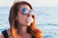 Young woman blowing bubble gum Royalty Free Stock Photo