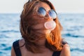 Young woman blowing bubble gum Royalty Free Stock Photo