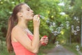 Young Woman Blowing Bubbles Royalty Free Stock Photo