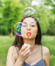 Young Woman Blowing Bubbles Royalty Free Stock Photo
