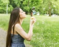 Young Woman Blowing Bubbles Royalty Free Stock Photo