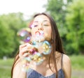 Young Woman Blowing Bubbles Royalty Free Stock Photo