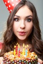 Woman blowing out candles Royalty Free Stock Photo