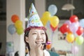 Young Woman Blowing Party Horn Royalty Free Stock Photo