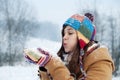 Young woman blowing snow to away Royalty Free Stock Photo