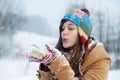 Young woman blowing snow to away Royalty Free Stock Photo