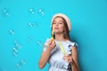 Young woman blowing soap bubbles Royalty Free Stock Photo