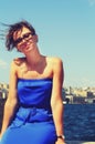 Young woman in blue dress posing with a view of the Bosphorus in Istanbul on a background Royalty Free Stock Photo