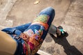 young woman in blue jeans and high heels in backyard summer fashion closeup