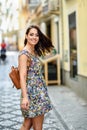 Young woman with blue eyes with brown wavy hair outdoors Royalty Free Stock Photo