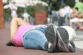 Young woman lying on the pavement in the city Royalty Free Stock Photo