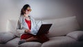 Young woman with blue light blocking glasses yellow lenses