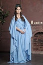 Young girl in blue vintage dress late 19th century Royalty Free Stock Photo