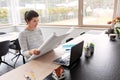 Young woman with blueprint working at home office Royalty Free Stock Photo