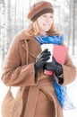 Young woman with books in winter