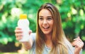 Young woman a bottle of sunblock outside Royalty Free Stock Photo