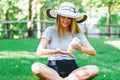 Young woman a bottle of sunblock outside Royalty Free Stock Photo