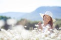 A young woman with a bouquet of white daisies on a meadow Royalty Free Stock Photo