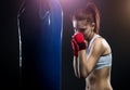 Young woman boxing on a punching bag Royalty Free Stock Photo