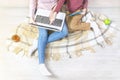 Young woman and boy on the floor in the apartment. Mom holds a laptop and shows a hand to her son at the screen, home schooling, Royalty Free Stock Photo