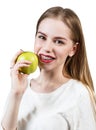 Young woman with brackets on teeth eating apple Royalty Free Stock Photo