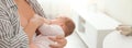 Young woman breast feeding her little baby, closeup. Banner design Royalty Free Stock Photo