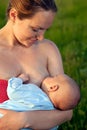 Young woman breastfeeding her baby Royalty Free Stock Photo