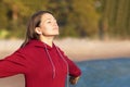 young woman breathes fresh air in nature, on the beach