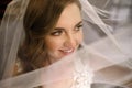 A young woman the bride covered her face with a veil before meeting with the groom