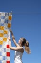 Young woman and bright laundry Royalty Free Stock Photo