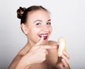 Young woman in bright makeup eating a tasty donut with icing. Funny joyful woman with sweets, dessert. dieting concept Royalty Free Stock Photo