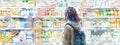 Young woman browsing the aisles of a well-stocked drugstore. Watercolor painting style. Royalty Free Stock Photo