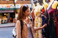 Young woman browsing clothes in the market Royalty Free Stock Photo