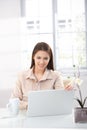 Young woman browsing internet at home