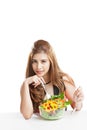 Young woman brunette present and eating salad Royalty Free Stock Photo