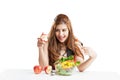 Young woman brunette present and eating salad Royalty Free Stock Photo